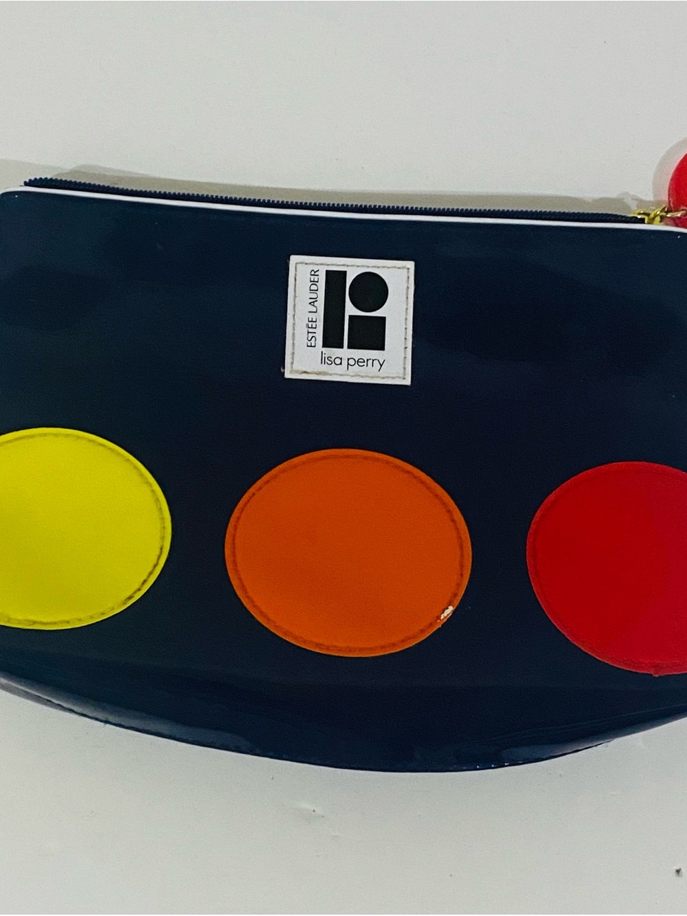 Estee Lauder makeup Glossy Navy Pouch with Yellow, Orange & Red Dots